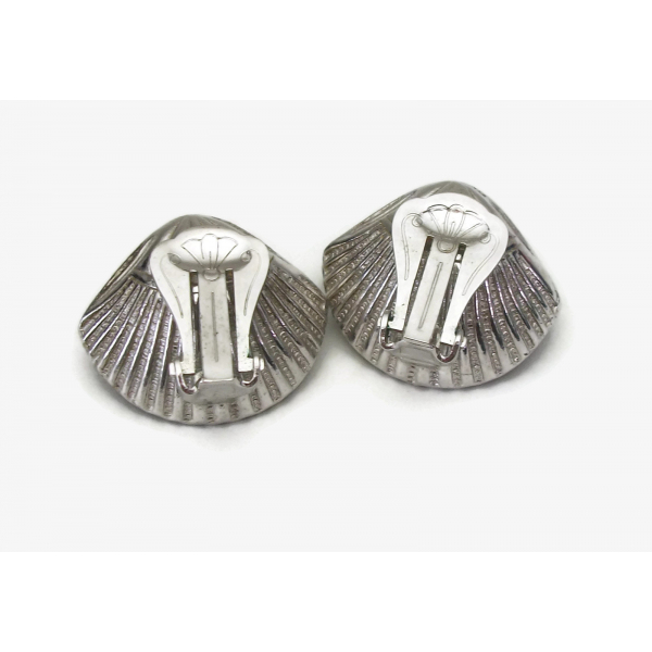 backs of silver oyster and pearl clip on earrings