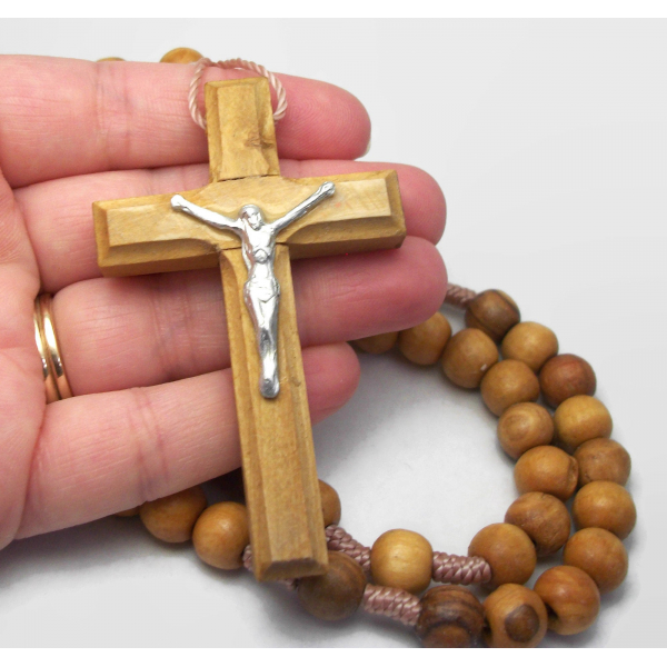 Close up of Jerusalem olive wood rosary cross
