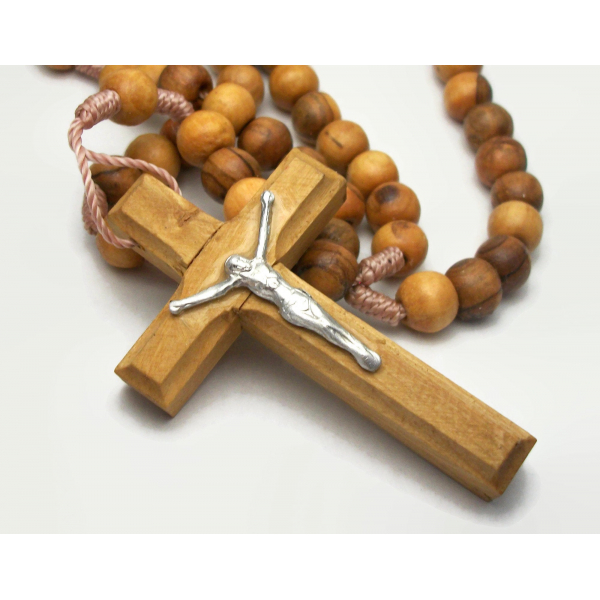 Closeup of olive wood rosary cross made in Jerusalem