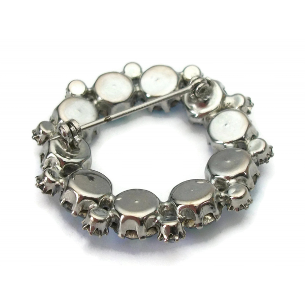 Back of vintage blue AB crystal circle pin brooch