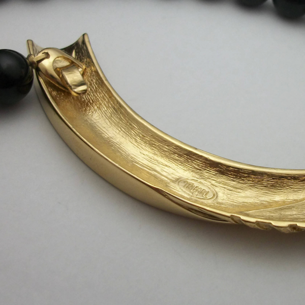 Trifari signature on vintage Trifari black enamel and gold bar necklace