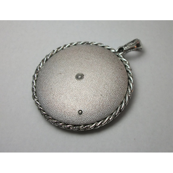 Back of vintage silver Asian rickshaw pendant