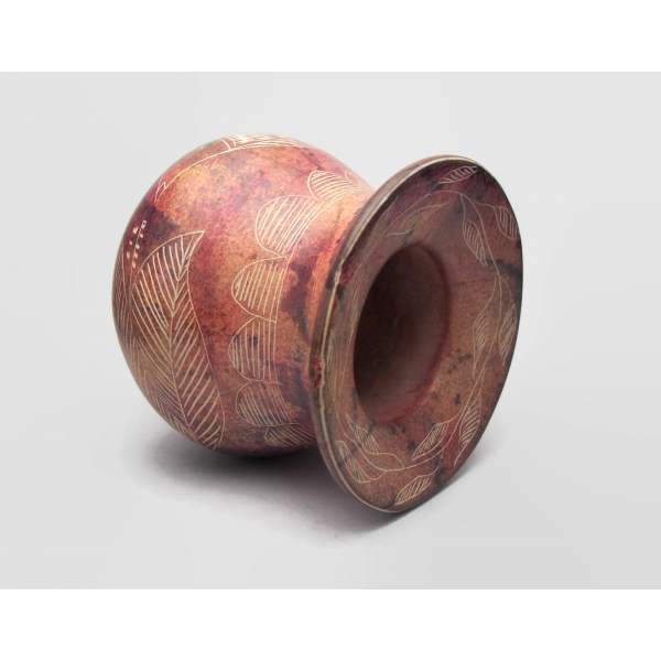 Side view of small stoneware pottery vessel