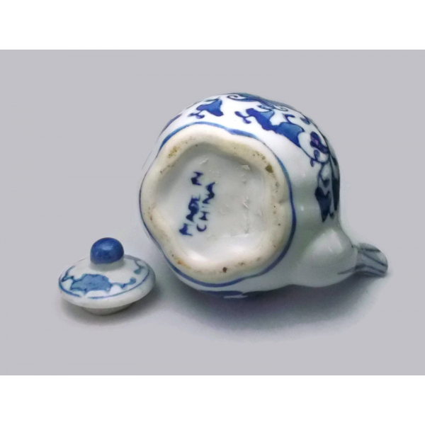 Bottom of miniature porcelain teapot