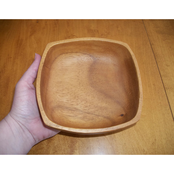 Picture of hand holding Scandinavian wood bowl