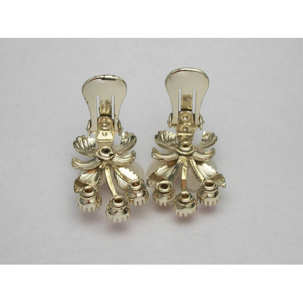 View of clips of floral celluloid clip on earrings