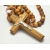 Closeup of olive wood rosary cross made in Jerusalem