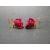 Side view of red rose floral clip on earrings