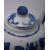 Close up of lid of porcelain teapot and small dot