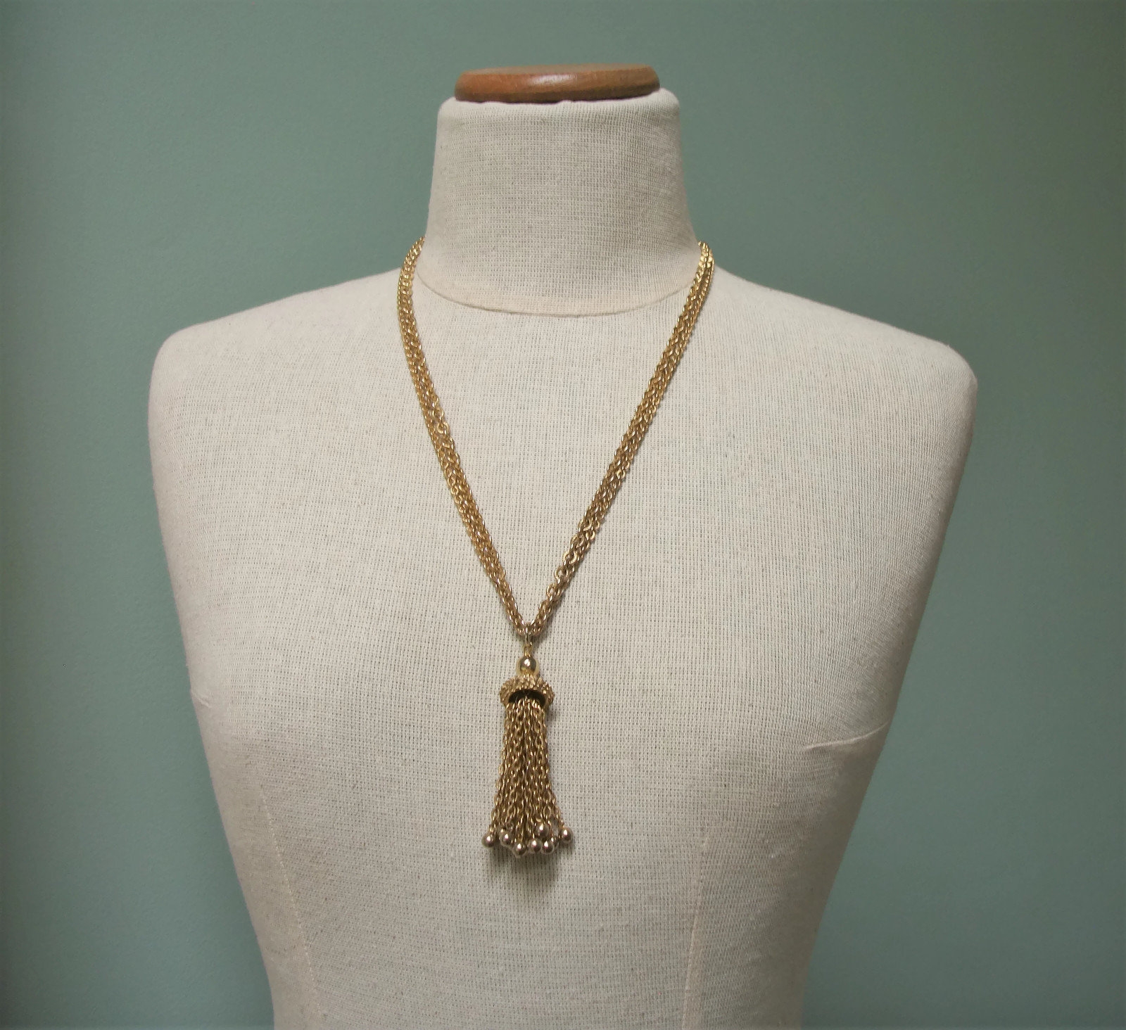 Gold tassel pendant necklace