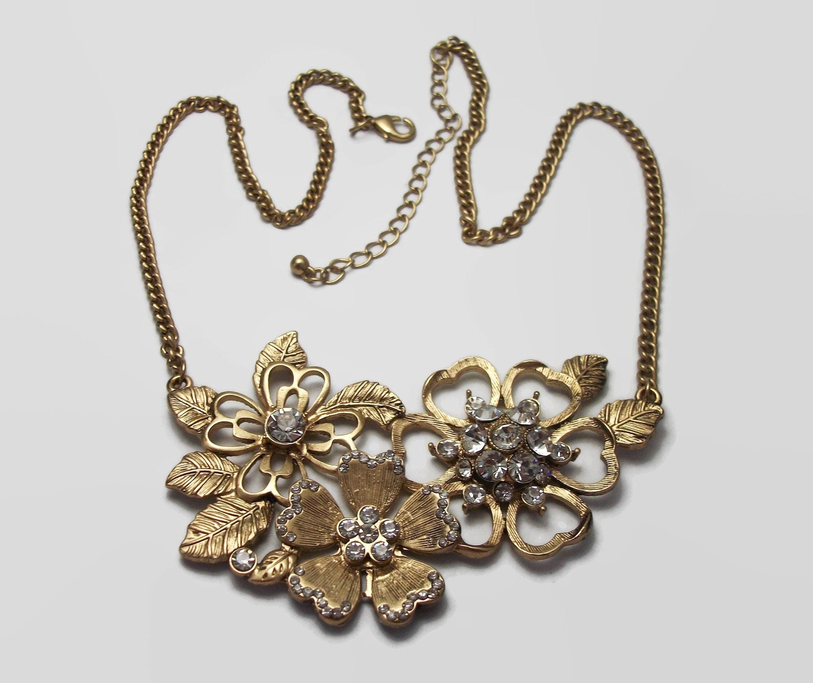 Gold Tone Flower Bib Necklace with Crystals Adjustable Length Gold Tone Flower Bib Necklace with Crystals Adjustable Length